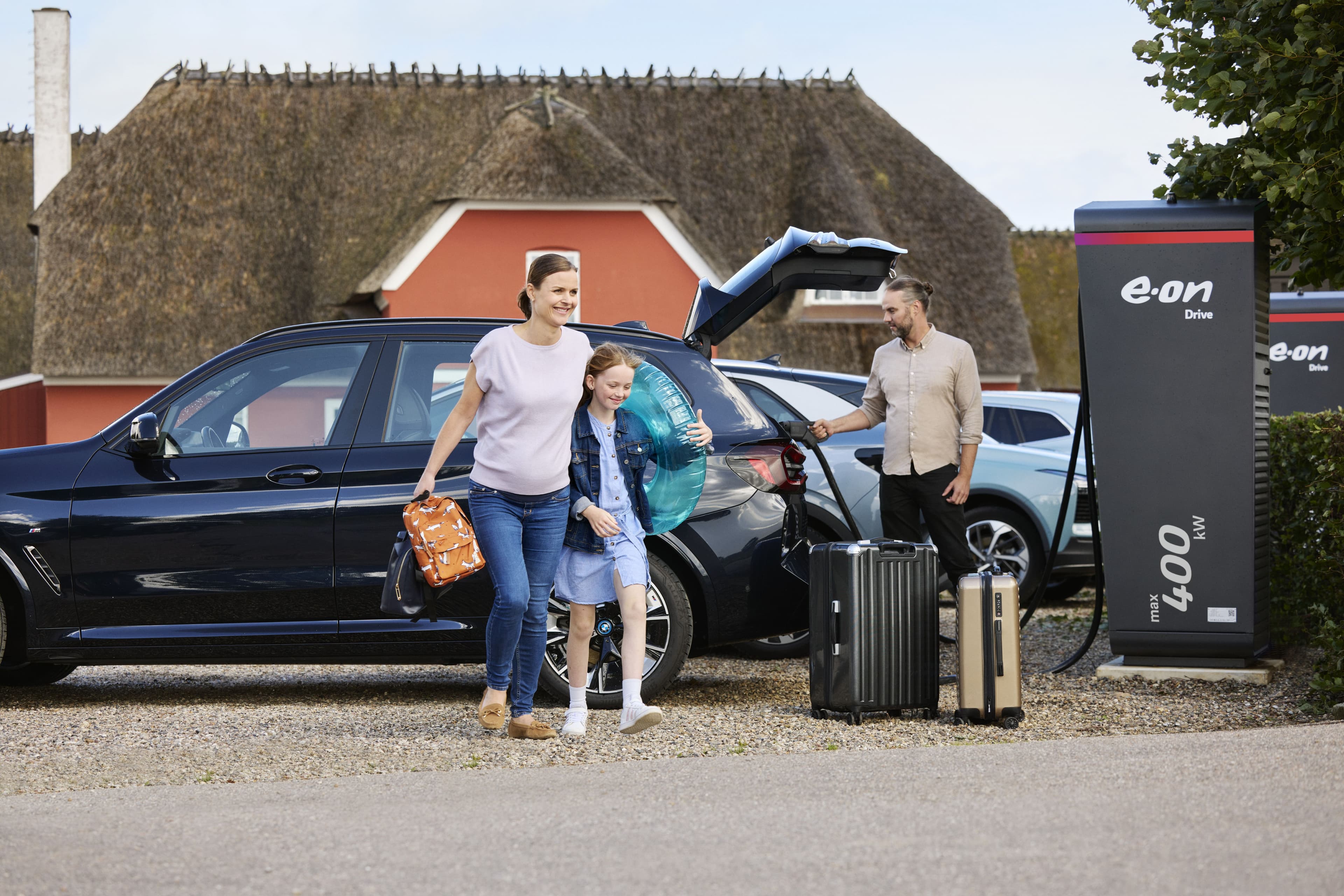 Family at holiday destination charging